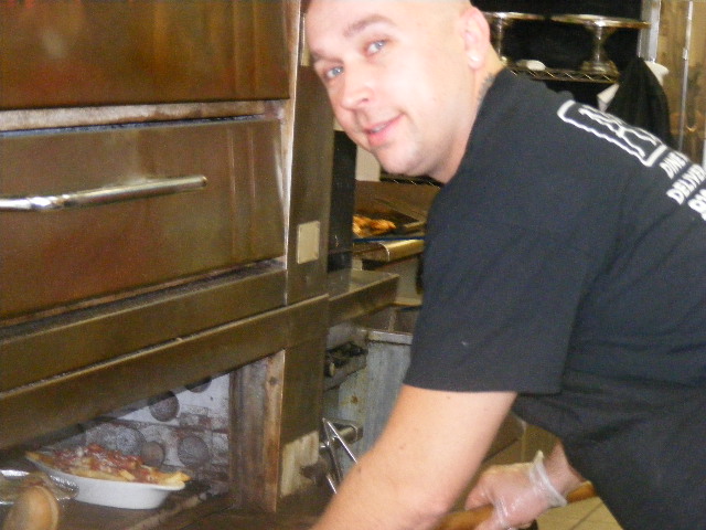 Owner Chef Thomas at the oven